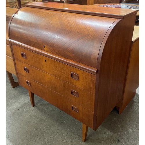 11 - A Swedish S.M.I. teak cylinder bureau, designed by Egon Ostergaard