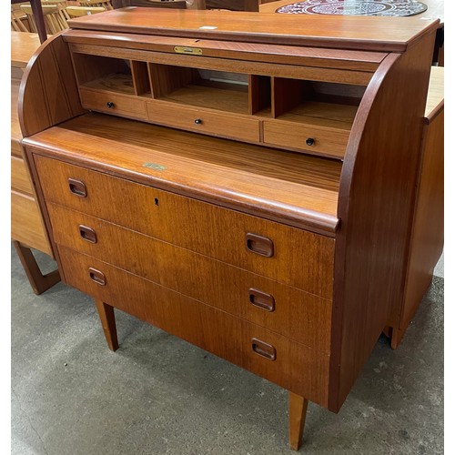 11 - A Swedish S.M.I. teak cylinder bureau, designed by Egon Ostergaard