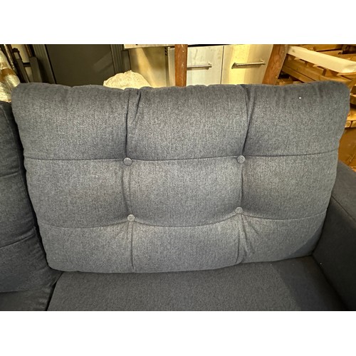 1573 - A blue upholstered three seater sofa - damaged