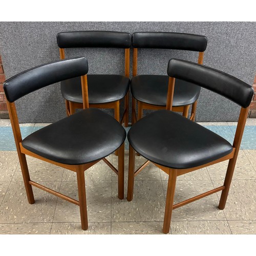 39 - A set of four McIntosh teak and black vinyl dining chairs