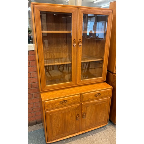 23J - An Ercol Blonde elm Windsor bookcase