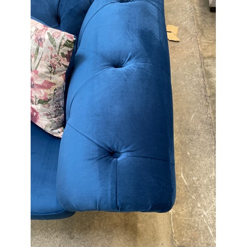 1467 - A blue velvet Chesterfield three seater sofa - RRP £1379.00