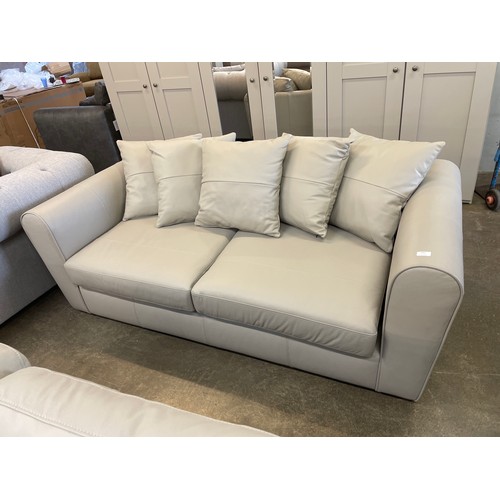 1468 - A stone leather three seater sofa