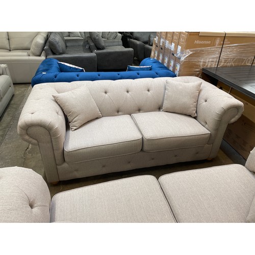 1471 - A beige weave Chesterfield three seater sofa - RRP £1379.00