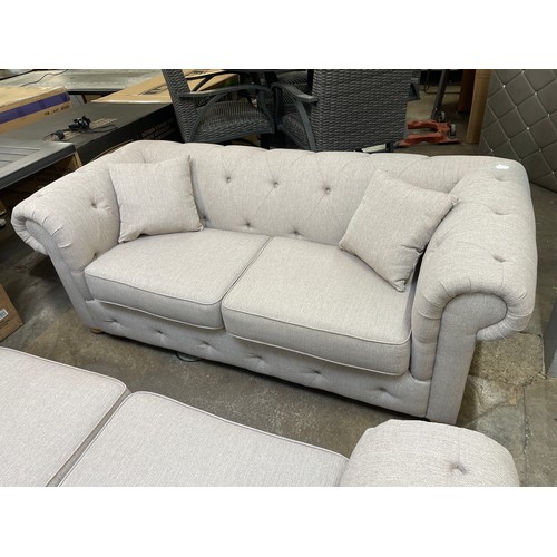 1472 - A beige weave Chesterfield three seater sofa - RRP £1379.00