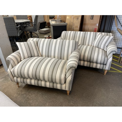 1474 - A linen and olive deckchair style upholstered two seater sofa and cuddle sofa