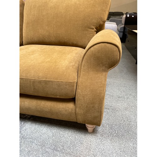 1479 - An Ochre velvet three seater sofa