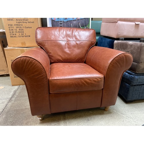 1487 - A tan leather armchair