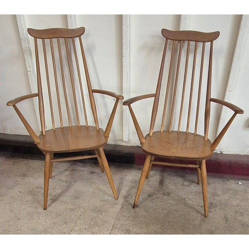 16 - A pair of Ercol Blonde elm and beech Goldsmith elbow chairs