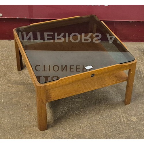 20 - A Myer teak and glass topped coffee table