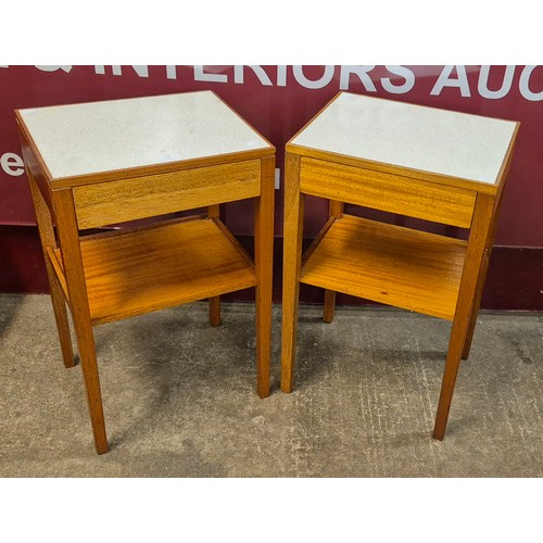 23 - A pair of Remploy teak and Formica topped single drawer bedside tables