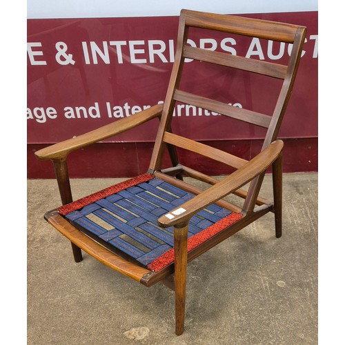 46 - A pair of Guy Rogers teak New Yorker armchairs. Please note this lot is being sold as a work of art.... 