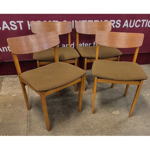 88 - A set of four teak dining chairs