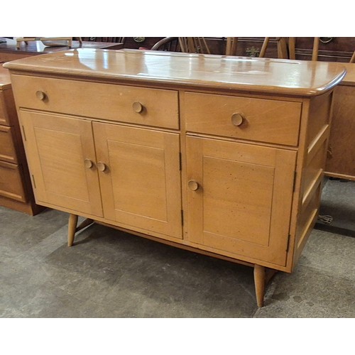 95 - An Ercol Blonde elm and beech Windsor sideboard