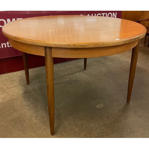 79 - A G-Plan Fresco teak circular extending dining table