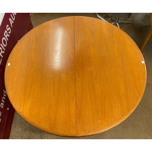 79 - A G-Plan Fresco teak circular extending dining table