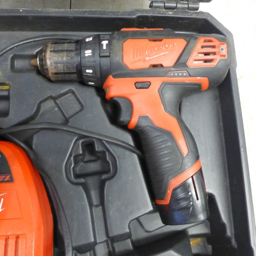 2001 - A Milwaukee M12BPD cordless power drill with two 12v Li-ion batteries and charger