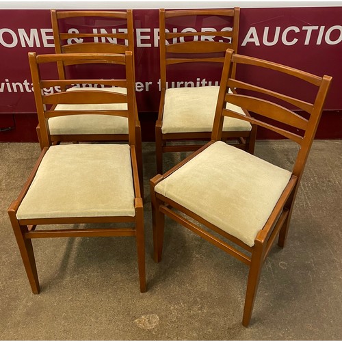 101 - A set of four teak dining chairs