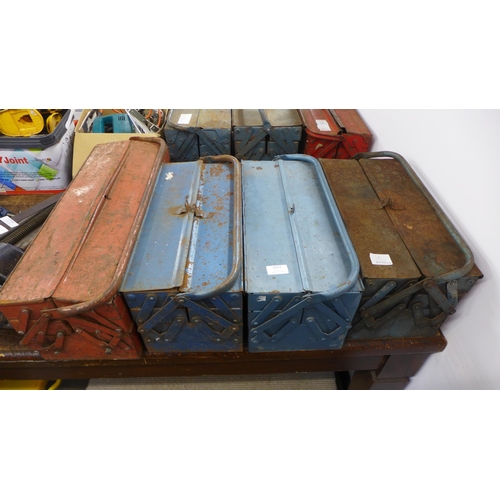 2033 - 4 metal cantilever tool boxes with assorted hand tools including spanners, sockets, drill bits etc.