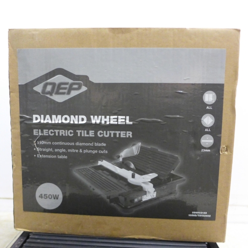 2038 - A QEP diamond wheel electric tile cutter, a Black and Decker BD710 electric planer and a Black and D... 