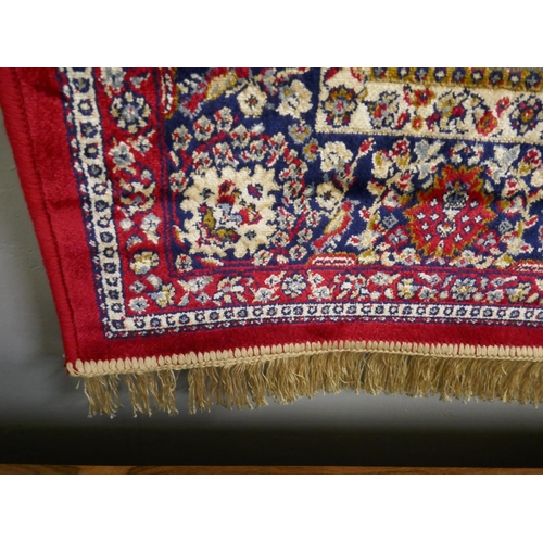 1349 - Red ground full pile cashmere rug with original medallion design 180x120cm