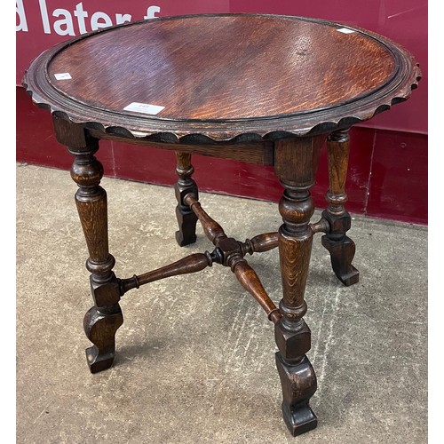 145 - An early 20th Century oak circular occasional table