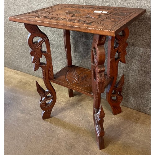 123 - An early 20th Century Burmese carved hardwood occasional table