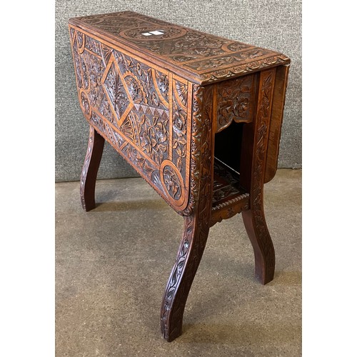 116 - A Victorian carved oak Sutherland table