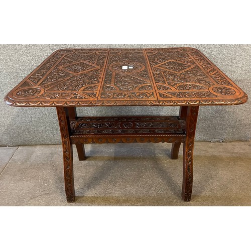 116 - A Victorian carved oak Sutherland table