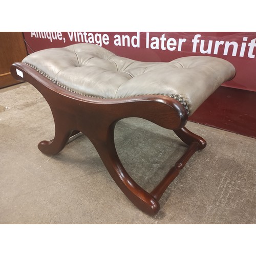 129 - A mahogany and grey leather upholstered X-frame stool