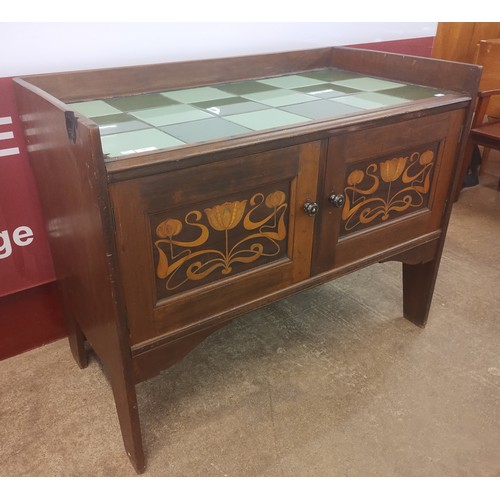 132 - An Art Nouveau Liberty & Co. style mahogany and tiled topped washstand