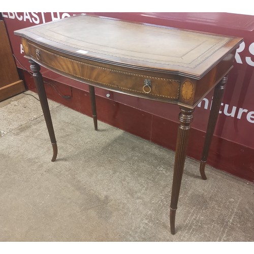 135 - A Regency style inlaid mahogany and green leather topped single drawer writing table