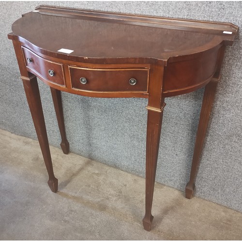 136 - A Regency style mahogany two drawer hall table