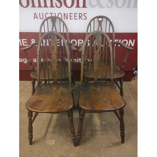 140 - A set of four 19th Century elm and beech Windsor kitchen chairs