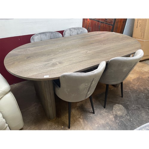 1394 - An oval grey wash dining table with brass detail and four grey velvet chairs  *This lot is subject t... 