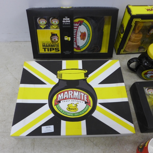 2076 - A large collection of Marmite items including a canvas print, oven glove, cheese tool set, egg cups,... 