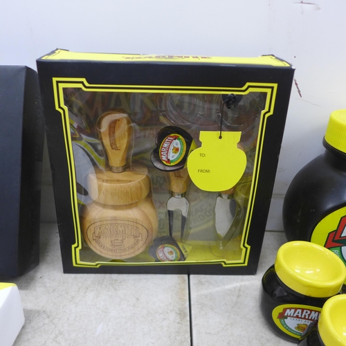 2076 - A large collection of Marmite items including a canvas print, oven glove, cheese tool set, egg cups,... 