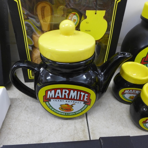 2076 - A large collection of Marmite items including a canvas print, oven glove, cheese tool set, egg cups,... 