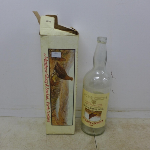 2091 - An empty 4.5 litre Famous Grouse Scotch Whisky glass bottle