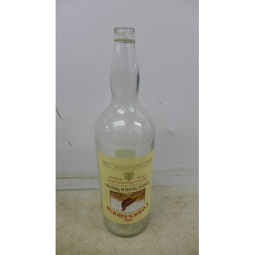 2091 - An empty 4.5 litre Famous Grouse Scotch Whisky glass bottle