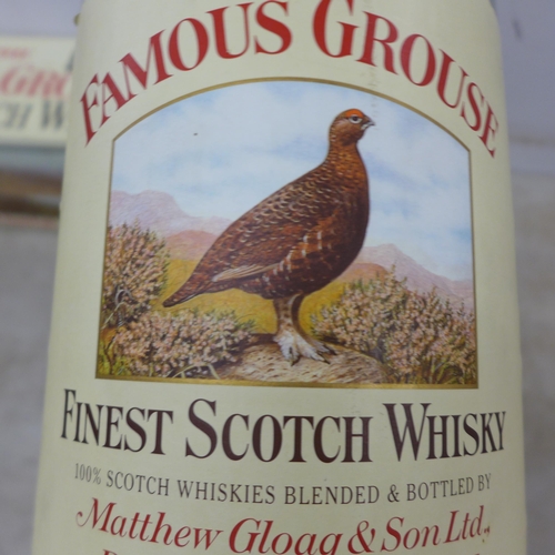 2091 - An empty 4.5 litre Famous Grouse Scotch Whisky glass bottle