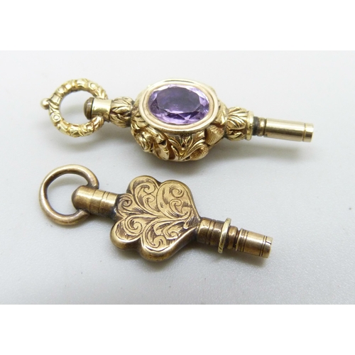 1003 - Two watch keys, one set with an amethyst and a red stone