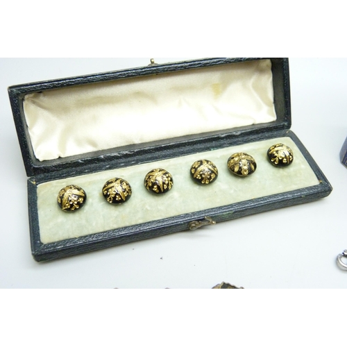 1005 - An enamelled box, two bracelets, other jewellery and case with six buttons, (5+1), etc.