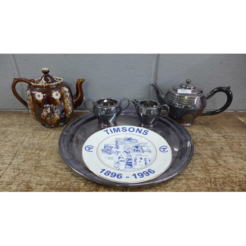 1041 - A 19th Century bargeware teapot, repaired chip on the lid, a three piece plated tea service with an ... 