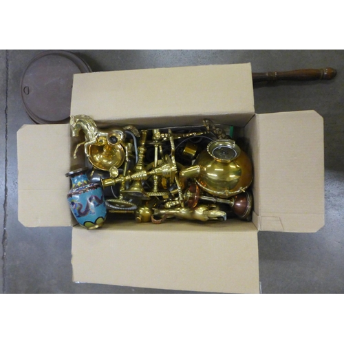 1074 - A box of brassware, including 19th Century brass candlesticks and a collection of pewter measures **... 