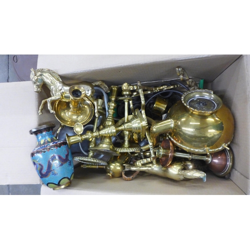 1074 - A box of brassware, including 19th Century brass candlesticks and a collection of pewter measures **... 