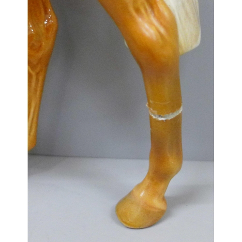 615 - Three Beswick Palomino horses, large racehorse with one hind leg a/f