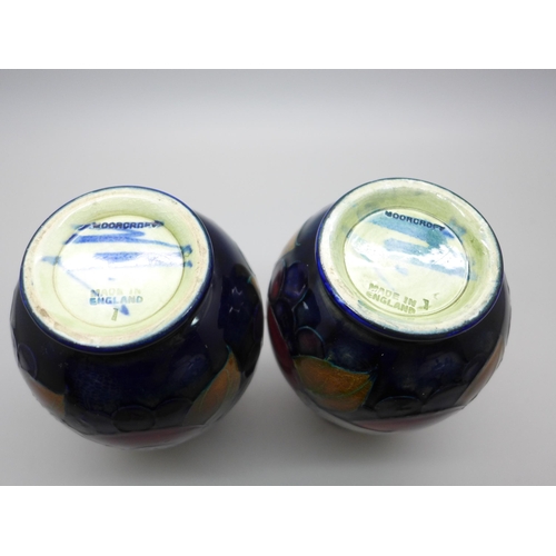 616 - Two Moorcroft vases, one open pomegranate design, 12cm, both signed, one a/f, hairline crack on rim