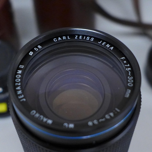 630 - Two Carl Zeiss Jena camera lenses, 75-300 macro zoom and 24mm, cased, four other lenses, Vivitar 19m... 