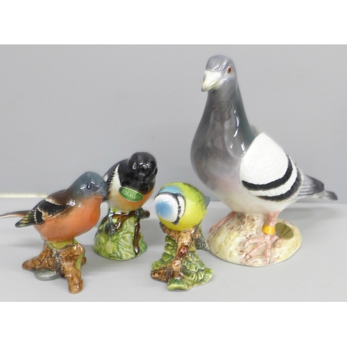 637 - Four Beswick model birds; Pigeon, Chaffinch, Blue Tit and Stonechat